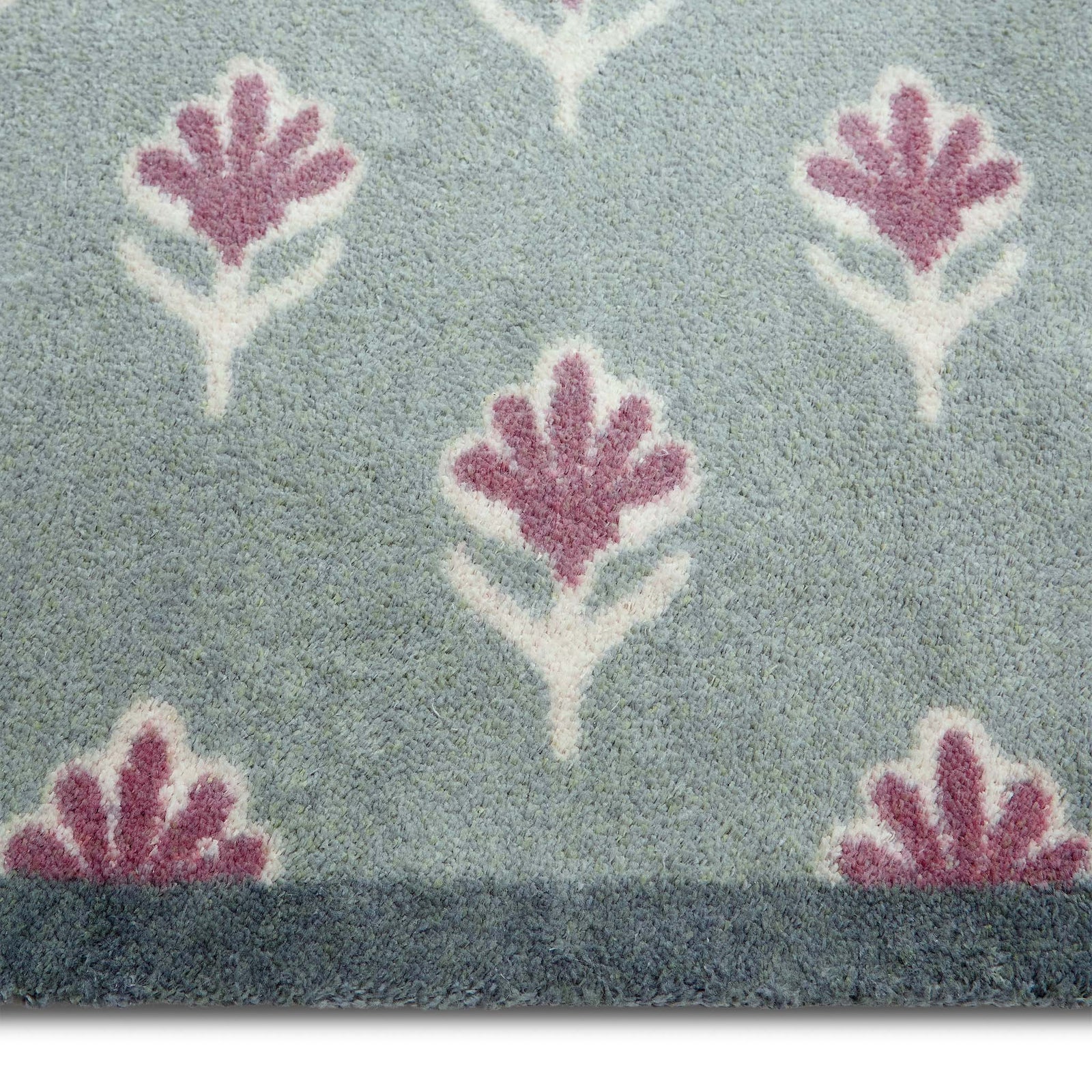 Ditsy Floral Green Runner- 100% recycled runner featuring a woodblock pattern of purple flowers.