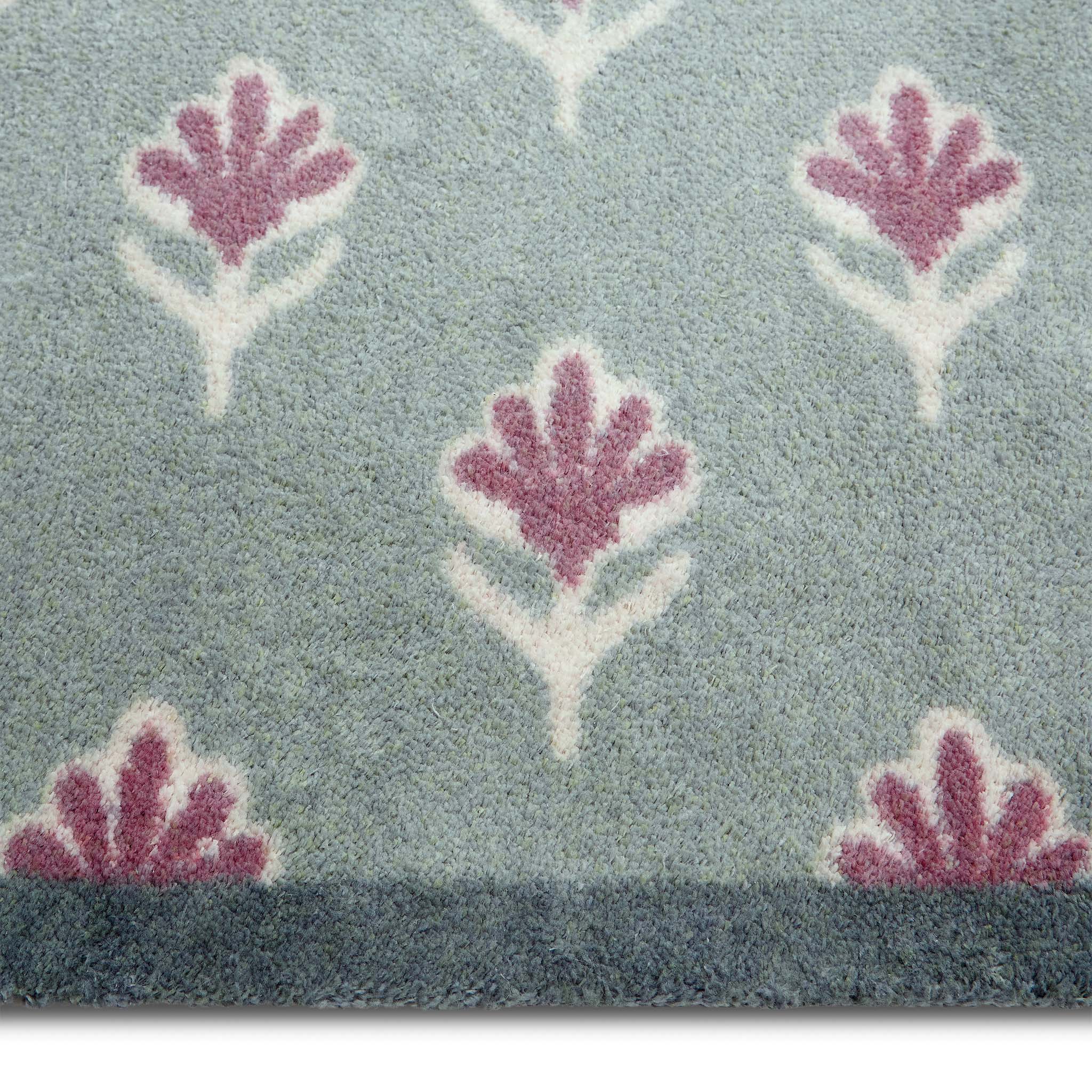 Ditsy Floral Green Runner- 100% recycled runner featuring a woodblock pattern of purple flowers.