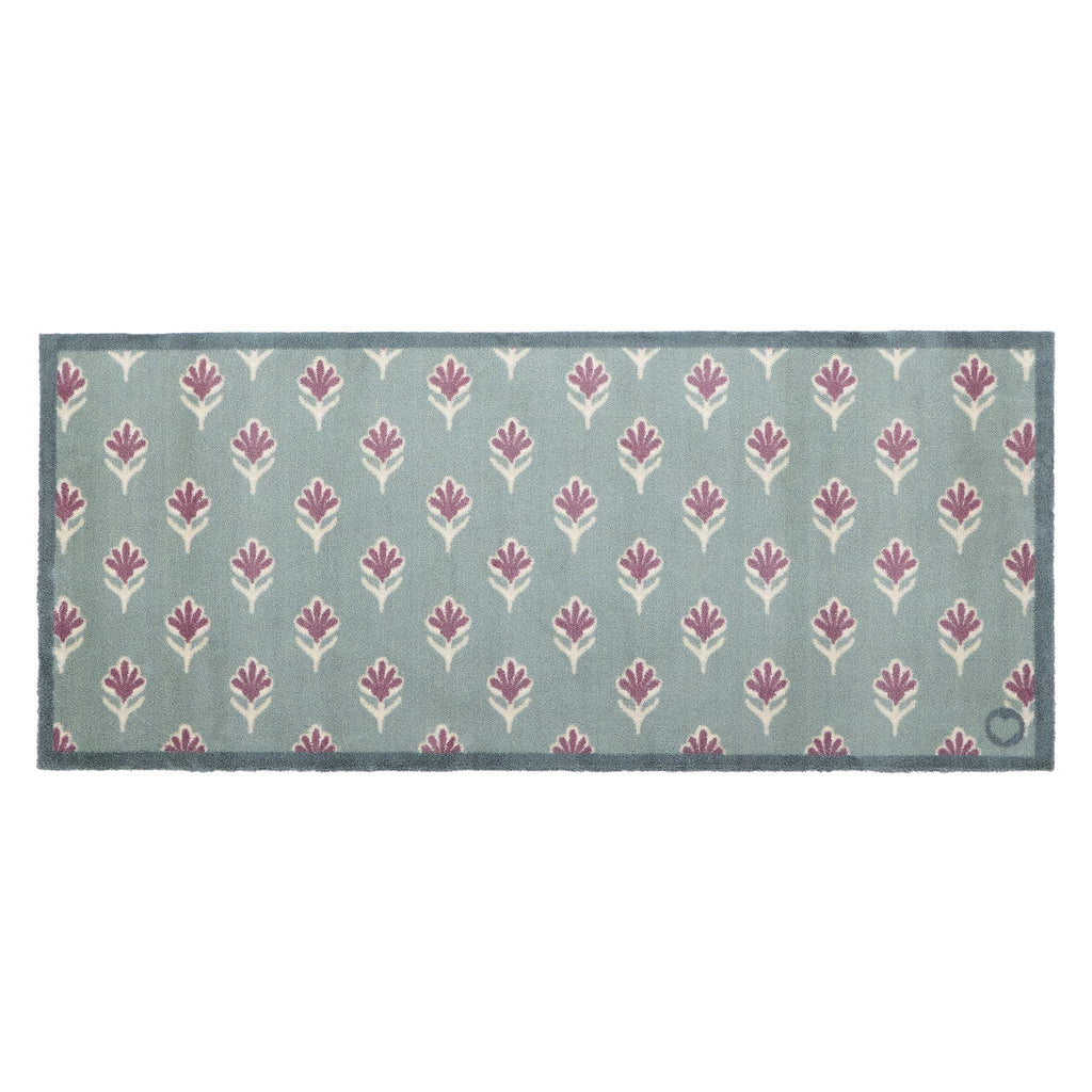 Ditsy Floral Green Runner- 100% recycled runner featuring a woodblock pattern of purple flowers.