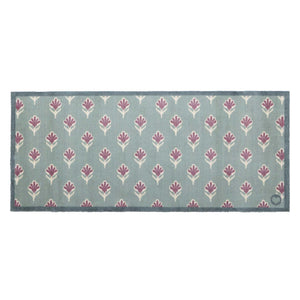 Ditsy Floral Green Runner- 100% recycled runner featuring a woodblock pattern of purple flowers.
