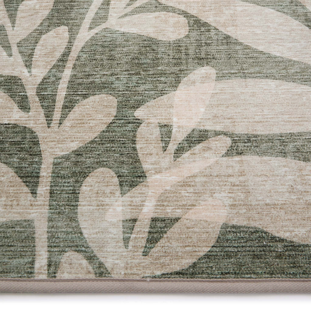 Eden Leaves Green Eco-Washable Runner- 100% recycled content runner featuring a white floral pattern against a green background.
