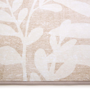 Eden Leaves Natural Eco-Washable Rug- 100% recycled polyester rug featuring a white floral pattern.