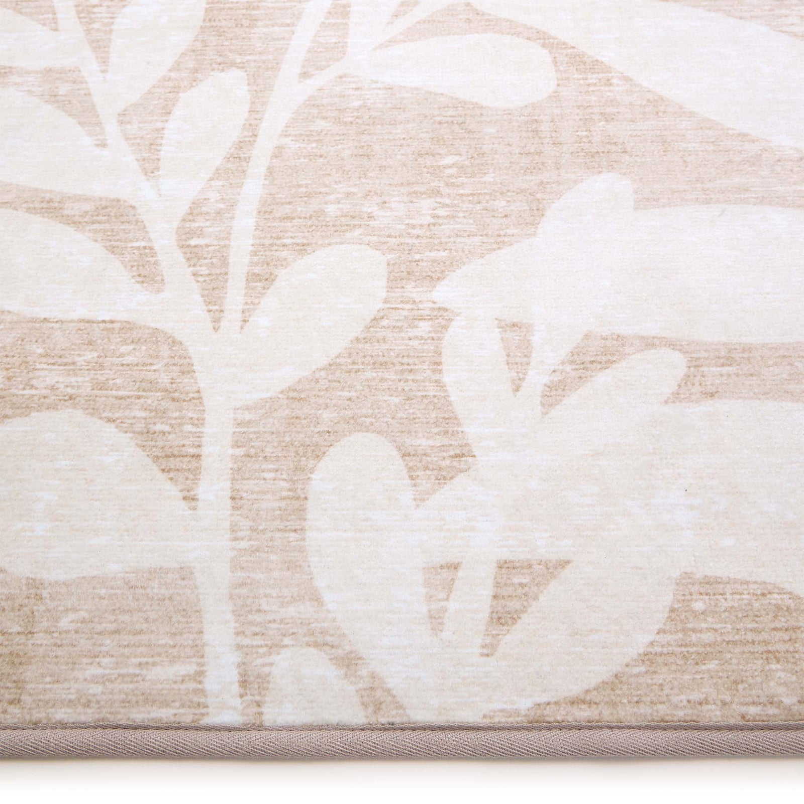 Eden Leaves Natural Eco-Washable Runner- 100% recycled polyester runner featuring a white floral pattern.