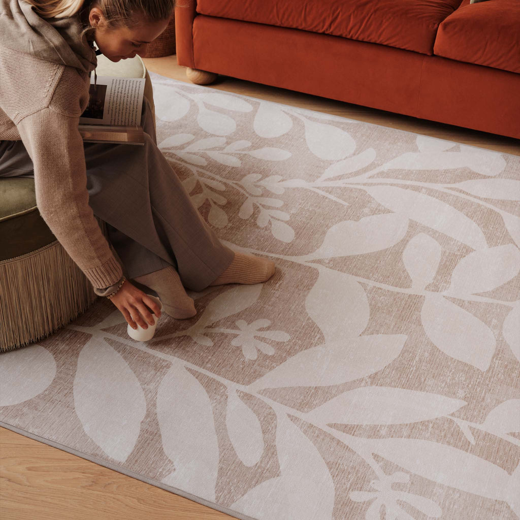 Eden Leaves Natural Eco-Washable Rug- 100% recycled polyester rug featuring a white floral pattern.