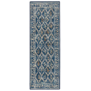 A long rectangular area rug with a distressed blue background and an intricate cream and brown floral lattice pattern.