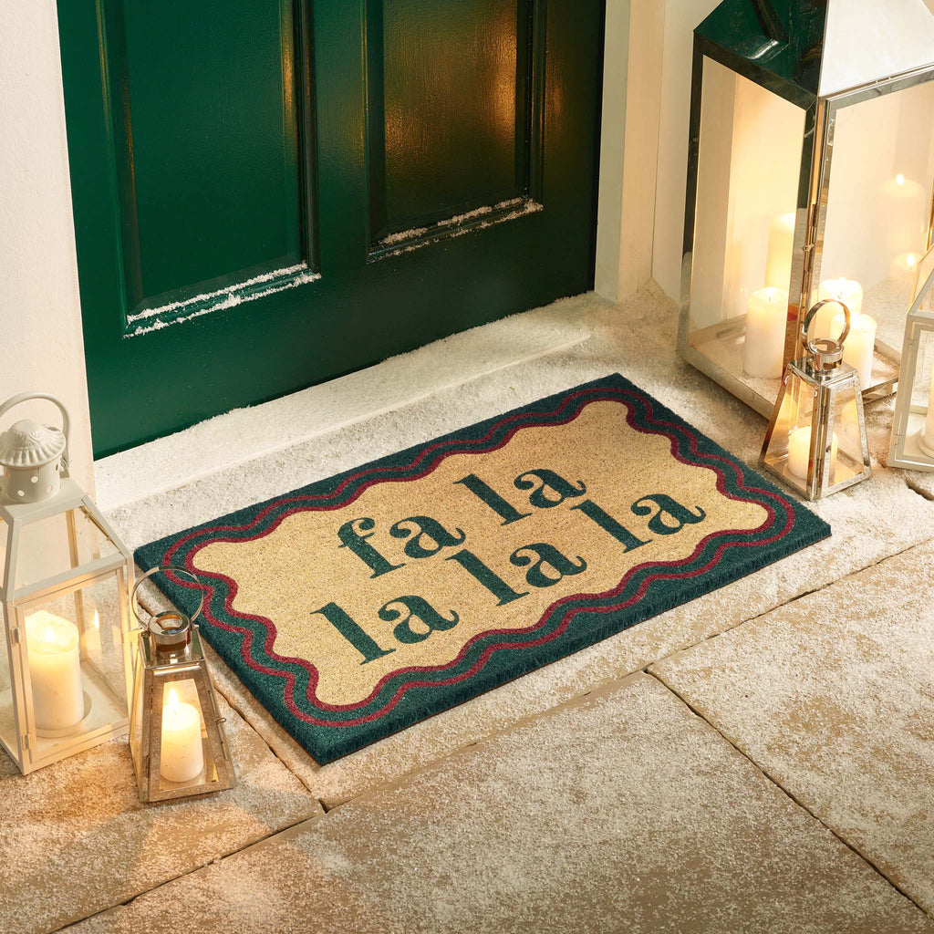 Christmas Fa La La La La Coir Doormat-. Made from eco-friendly materials featuirng a graphic design.