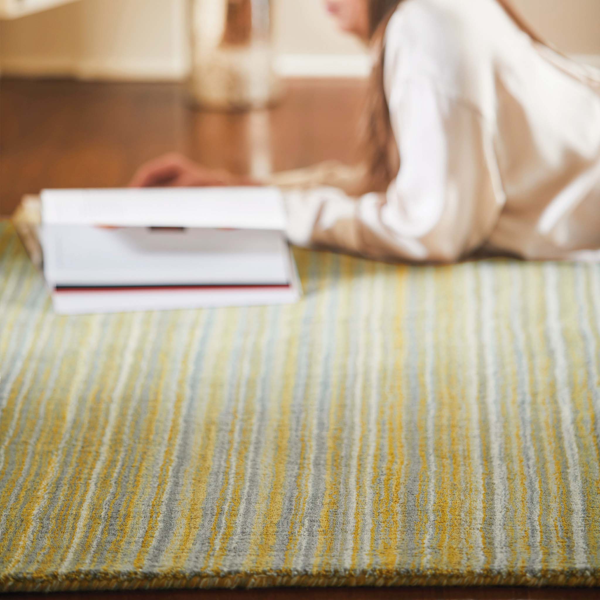 Fine Stripes Ochre Rug - a 100% yellow wool rug featuring a striped pattern. 