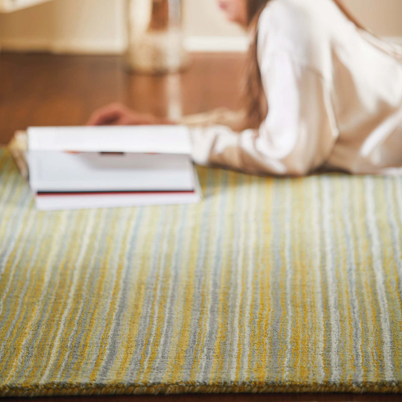 Fine Stripes Ochre Rug - a 100% yellow wool rug featuring a striped pattern. 