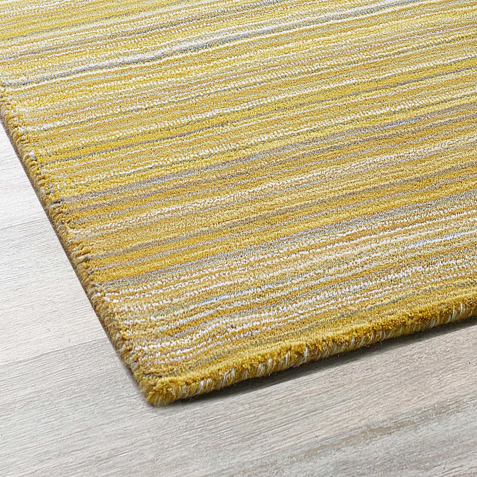 Fine Stripes Ochre Runner - a 100% yellow wool runner featuring a striped pattern. 