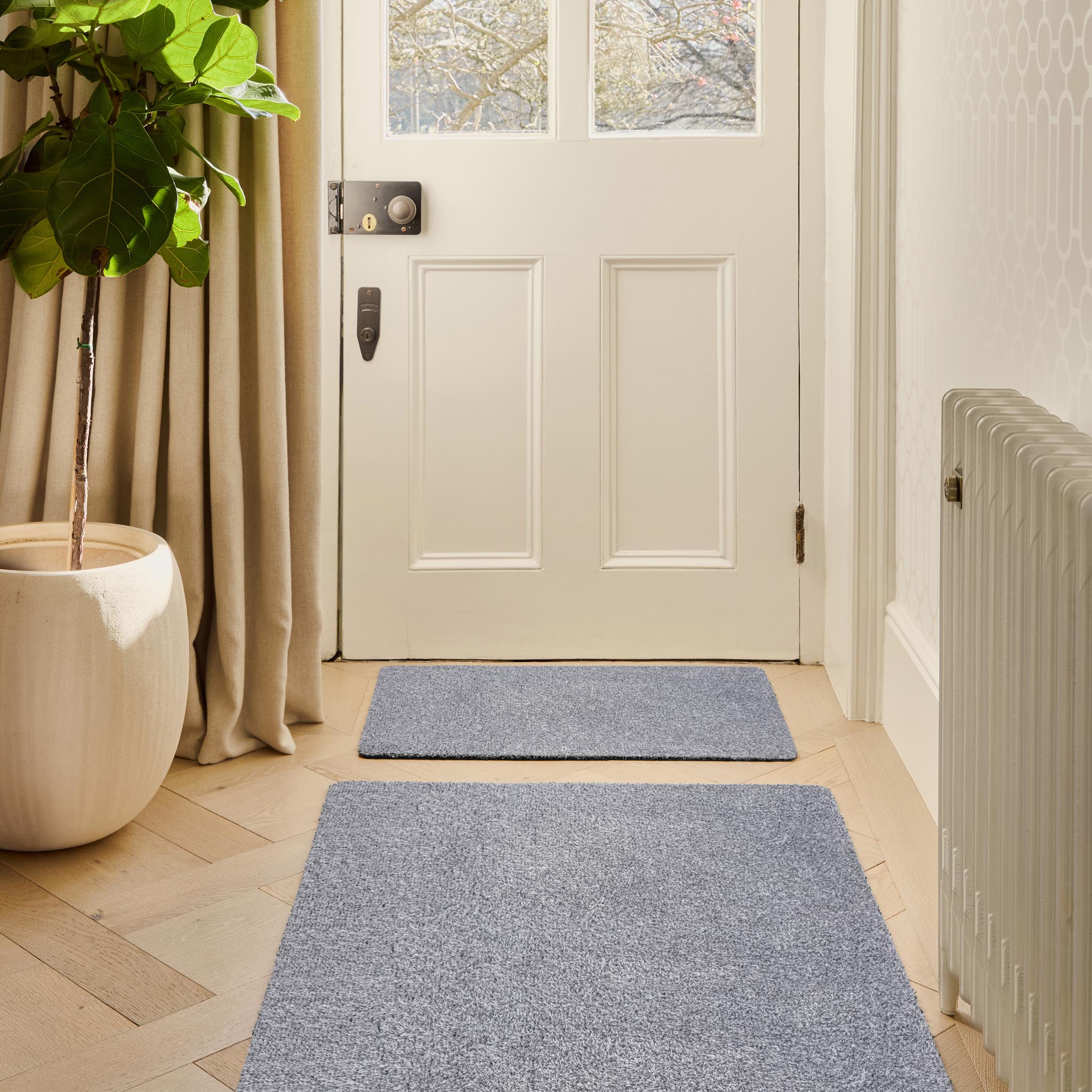 Plain Fleck Soft Silver Doormat made from recycled cotton, featuring a solid grey and silver design. 