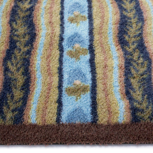 Floral Ribbon Motif Washable Doormat- a cotton doormat featuring wavy patterned blocks filled with lush green leaves and delicate floral motifs.