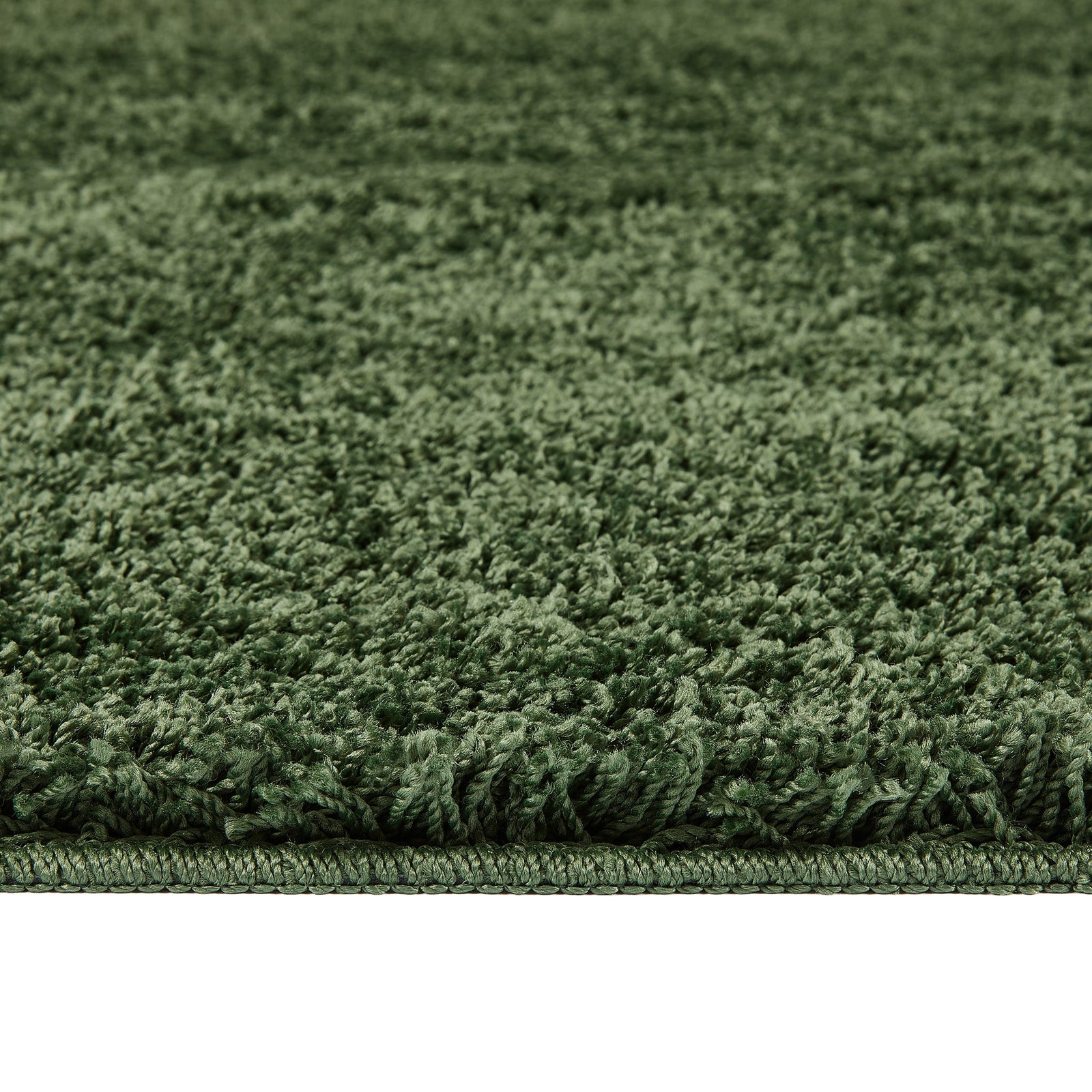 Forest Green Washable Rug in a solid green colour, fully machine washable.