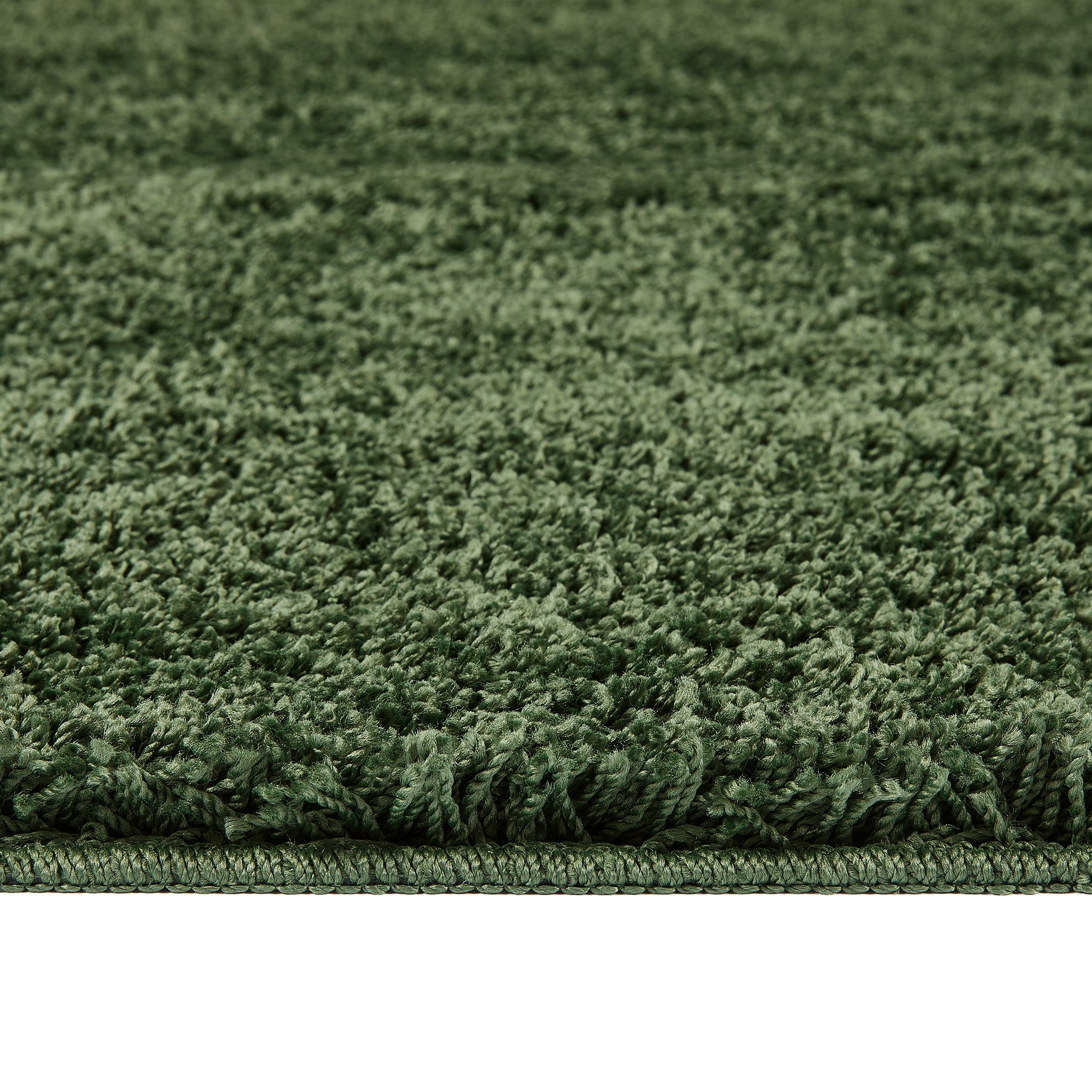 Forest Green Washable Rug in a solid green colour, fully machine washable.