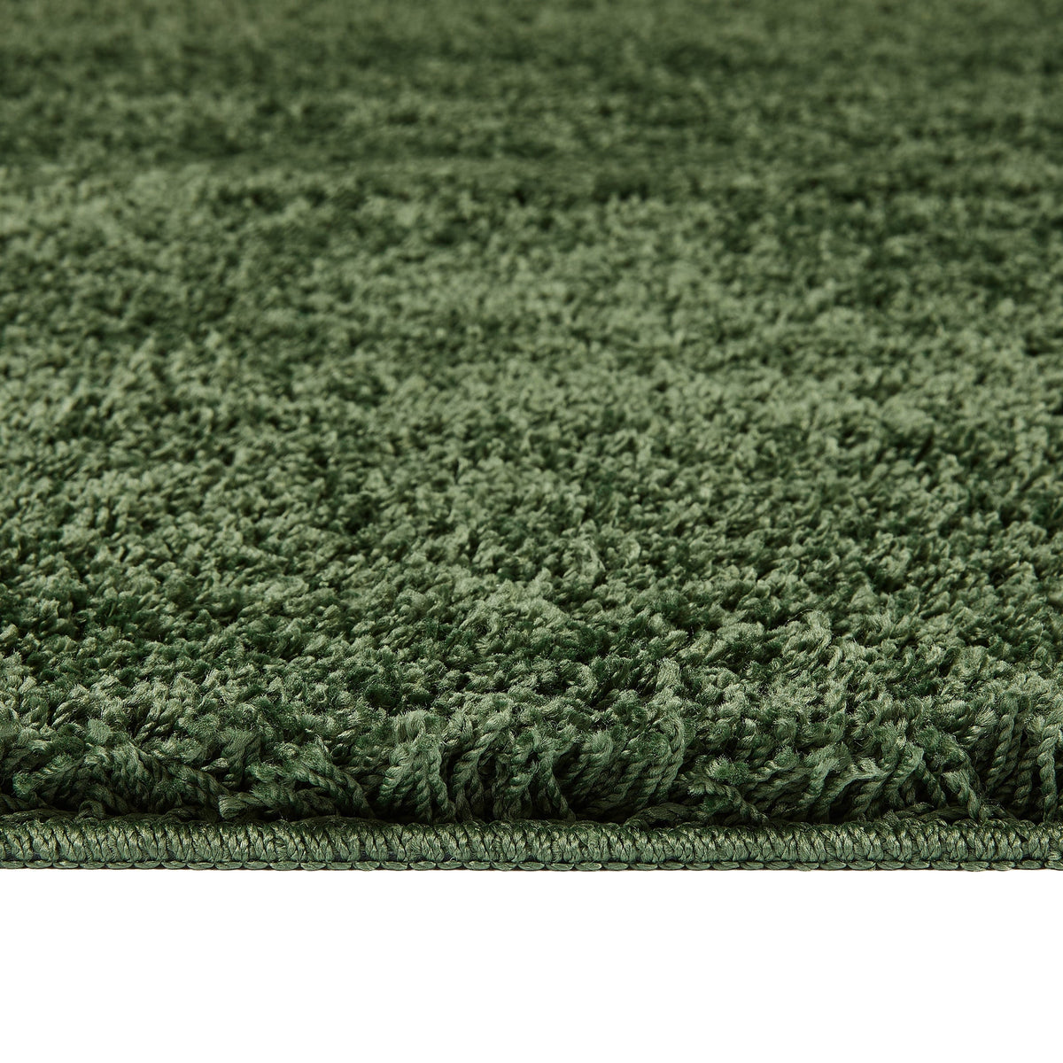 Forest Green Washable Rug in a solid green colour, fully machine washable.