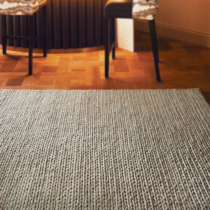 Fusion Oyster Rug made from wool, featuring woven design in solid dark cream.