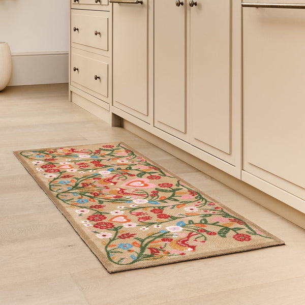 Garden Lovebirds Washable Runner- a 100% recycled cotton doormat featuring two lovebirds in shades of red, yellow, light pink, and cream, surrounded by floral vines. 