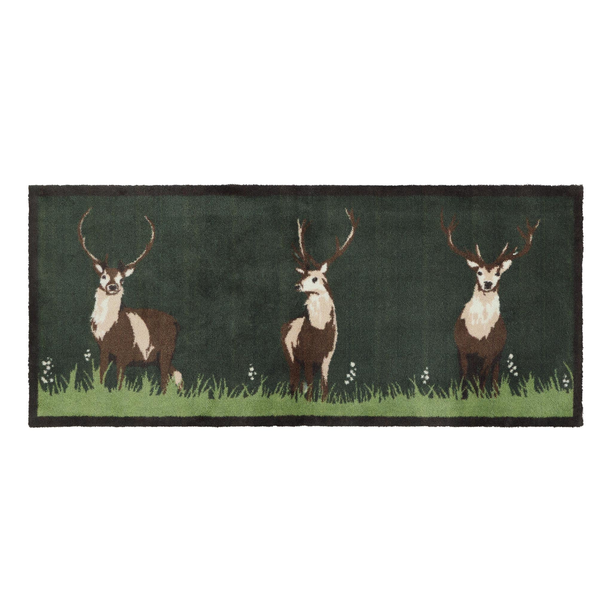 Green Deer Washable Runner- a cotton runner featuring three deers resting on green grass, surround by delicate white wildflowers.