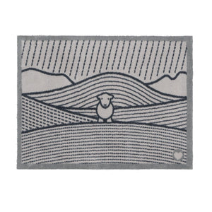 Herdy Lines Doormat- A cotton doormat featuring a Herdy in a field.