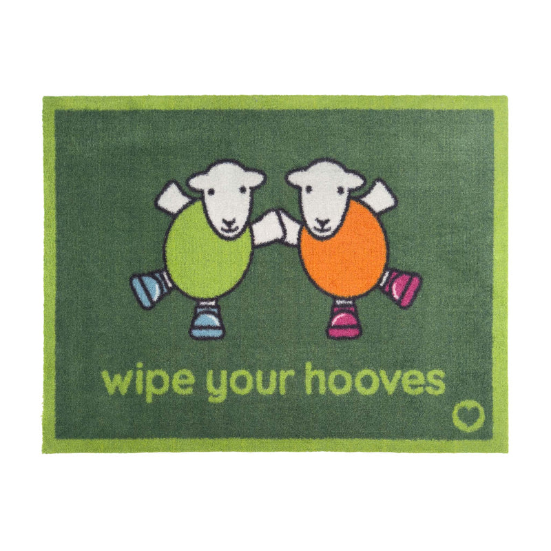 Herdy Wipe Your Hooves Green Doormat with a fun herdy design, styled in a doorway.