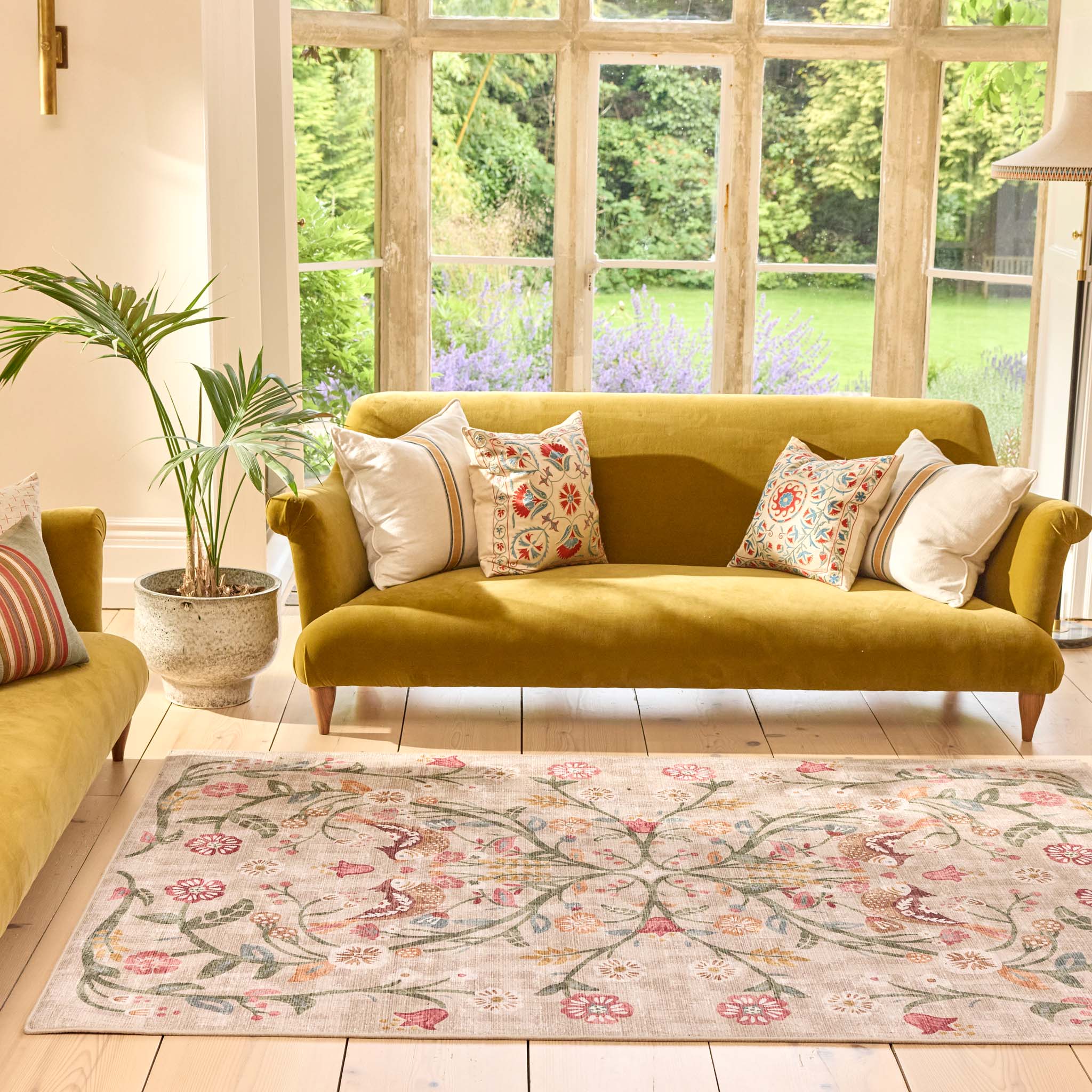 Heritage Garden Eco-Washable Rug with a nature-inspired floral design, styled in a living room.