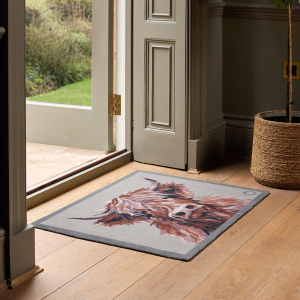 Heritage Highland Cow Washable Doormat- a cotton doormat featuring a white and brown highland cow.