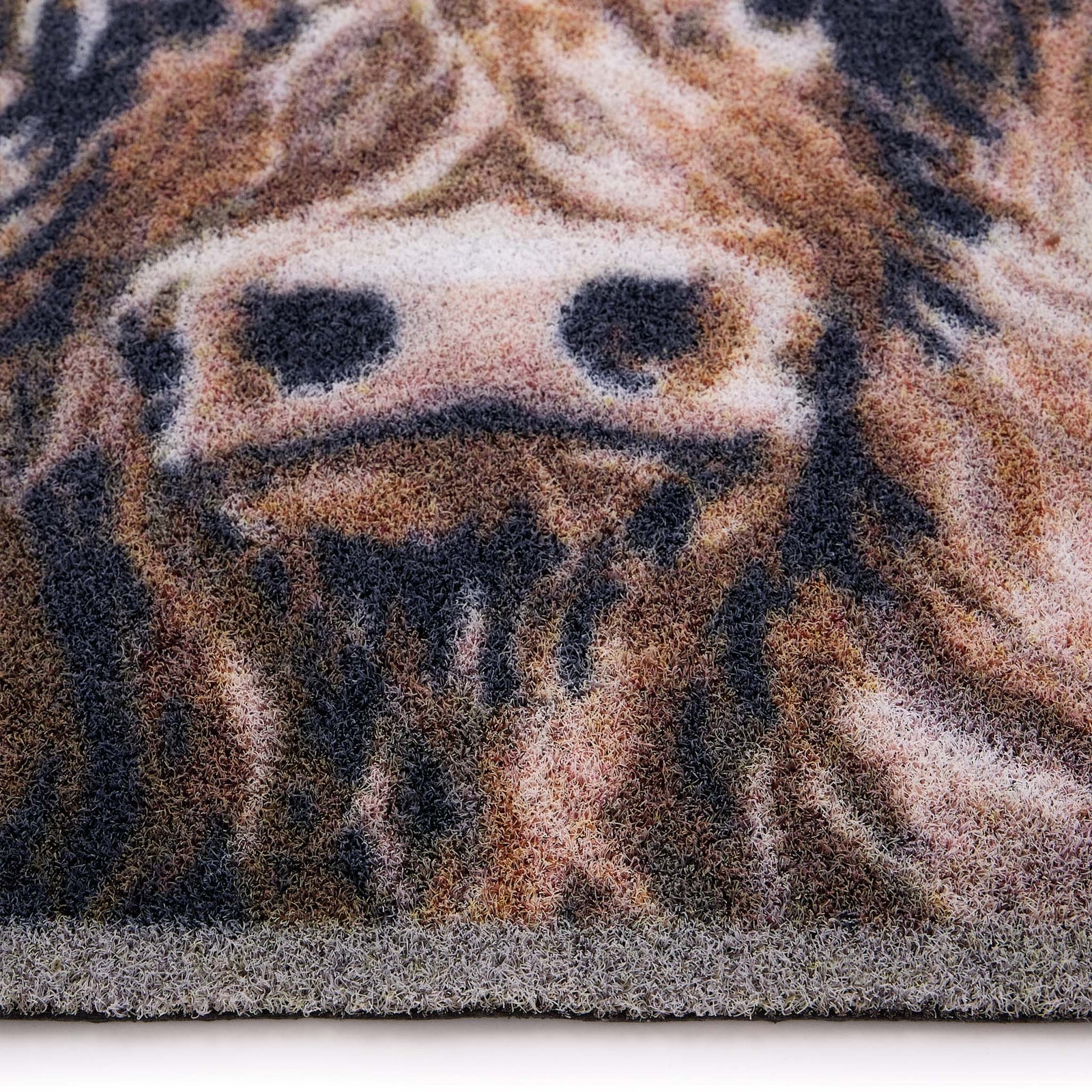 Close-up of the Heritage Highland Cow Grey Outdoor Doormat showing pile height and highland cow design.