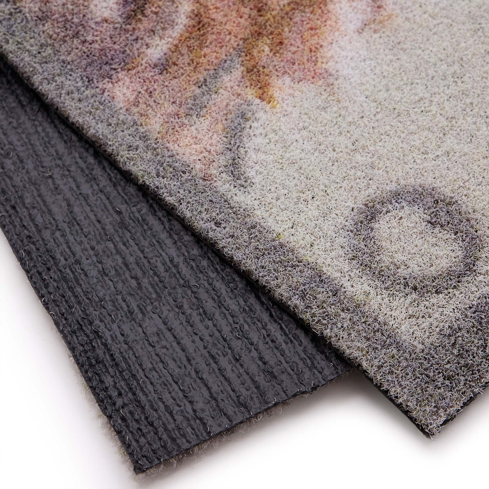 Close-up of Heritage Highland Cow Grey Outdoor Doormat showing the backing and the border. 