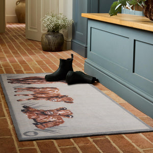 Heritage Highland Cow Washable Doormat- a cotton doormat featuring a white and brown highland cow.