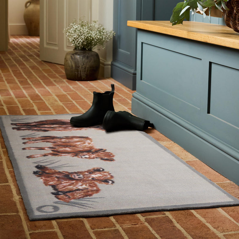 Heritage Highland Cow Washable Runner in a light grey- a 100% recycled cotton runner featuring three white and brown Highland cows.
