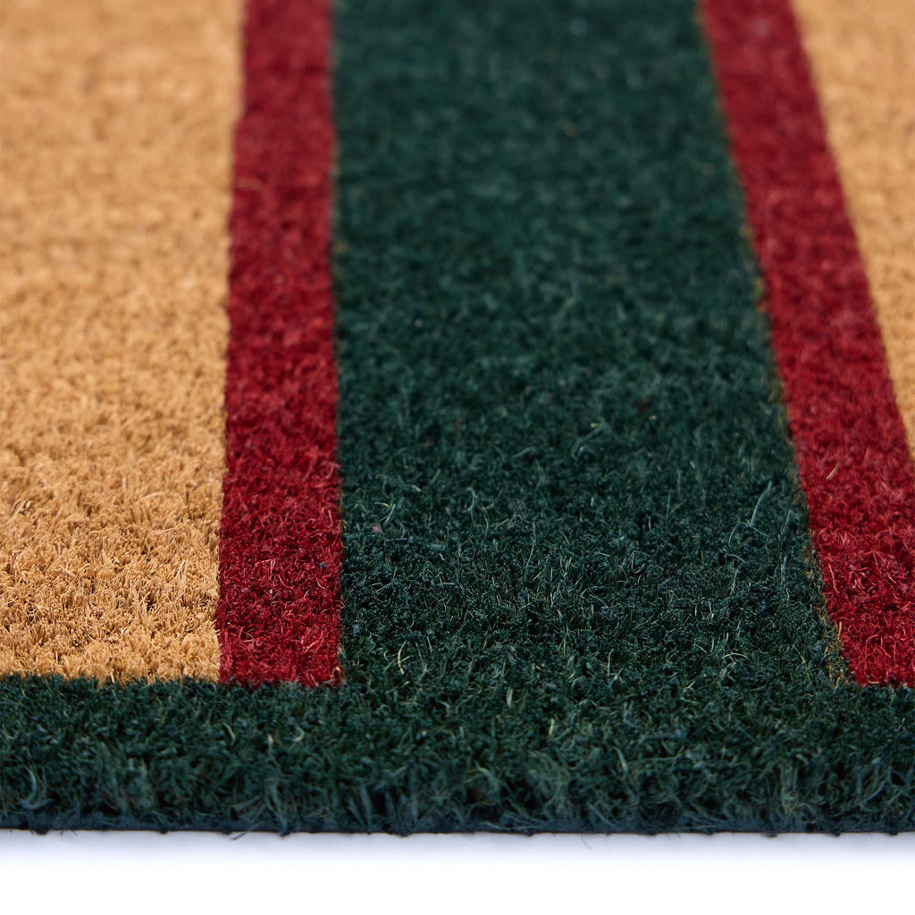 Heritage Stripe Green Coir Doormat with a red and green stripe pattern showing pile height.
