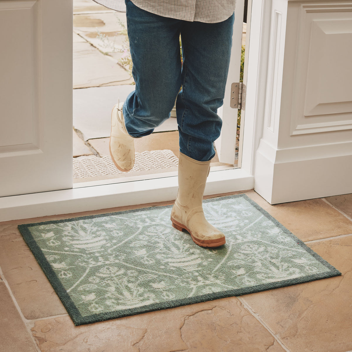 Highgrove Damask Silver Green Washable Doormat with a traditional style pattern, styled on tiled flooring.