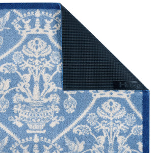 Close-up of the Highgrove Damask Tetbury Blue Washable Doormat with a blue traditional style pattern showing the rubber backing.