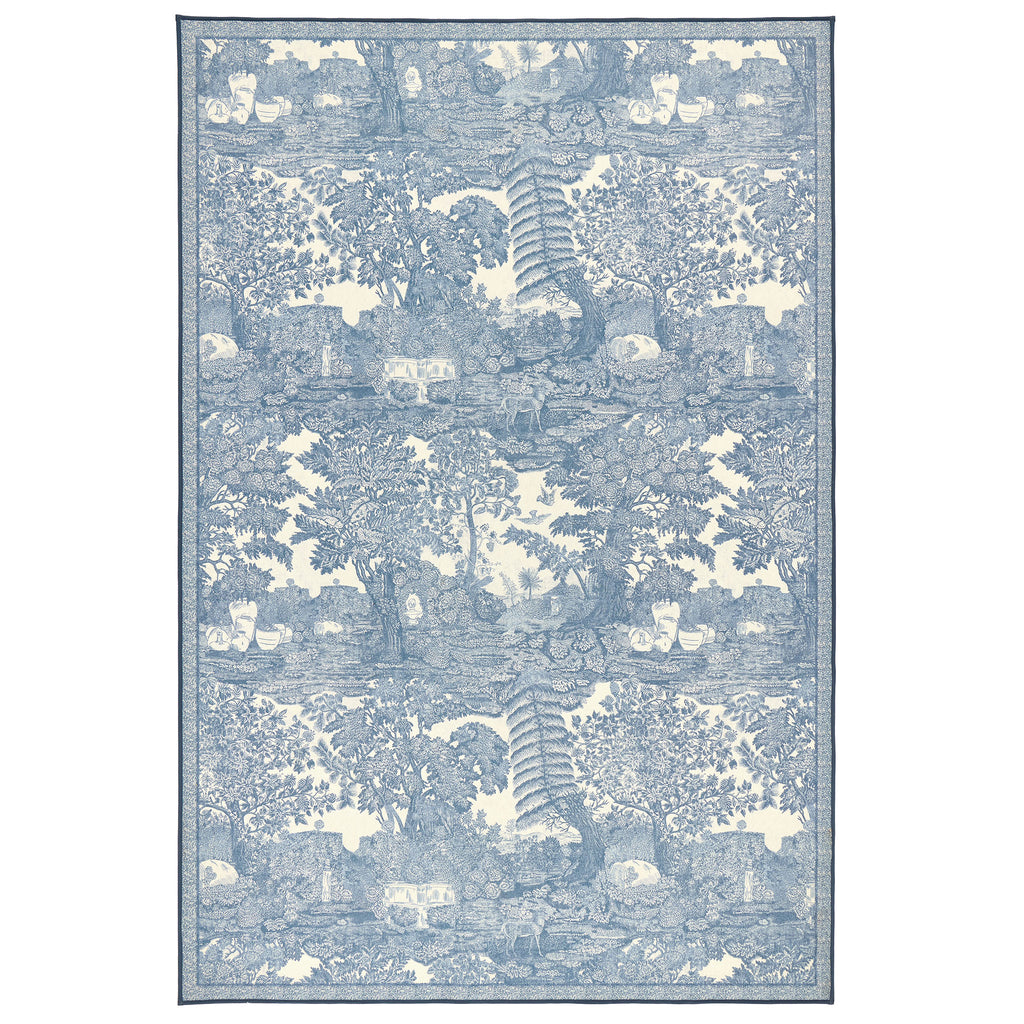 The Highgrove Toile Tetbury Blue Eco-Washable Rug with a blue and white nature inspired pattern. 
