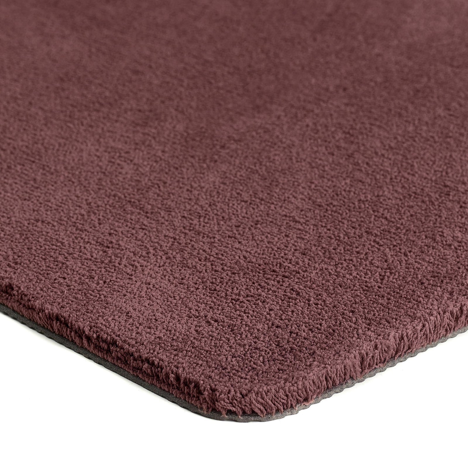 Close-up of Sense Rose Pink Washable Doormat showing pile height and dark pink colour.