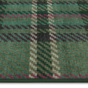 Isla Plaid Emerald Green Eco-Washable rug- a tartan rug in various shades of green.