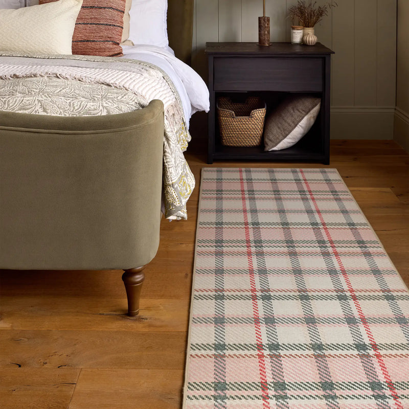 Isla Plaid Pink Eco-Washbable Runner with a tartan design, styled by the bed.