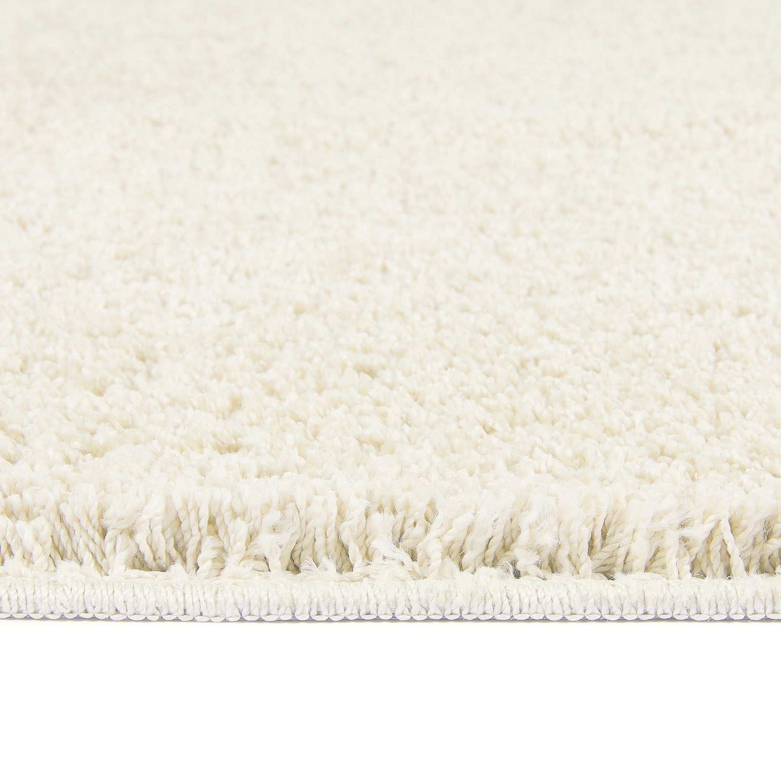 Ivory Washable Rug in a solid white colour, fully machine washable.