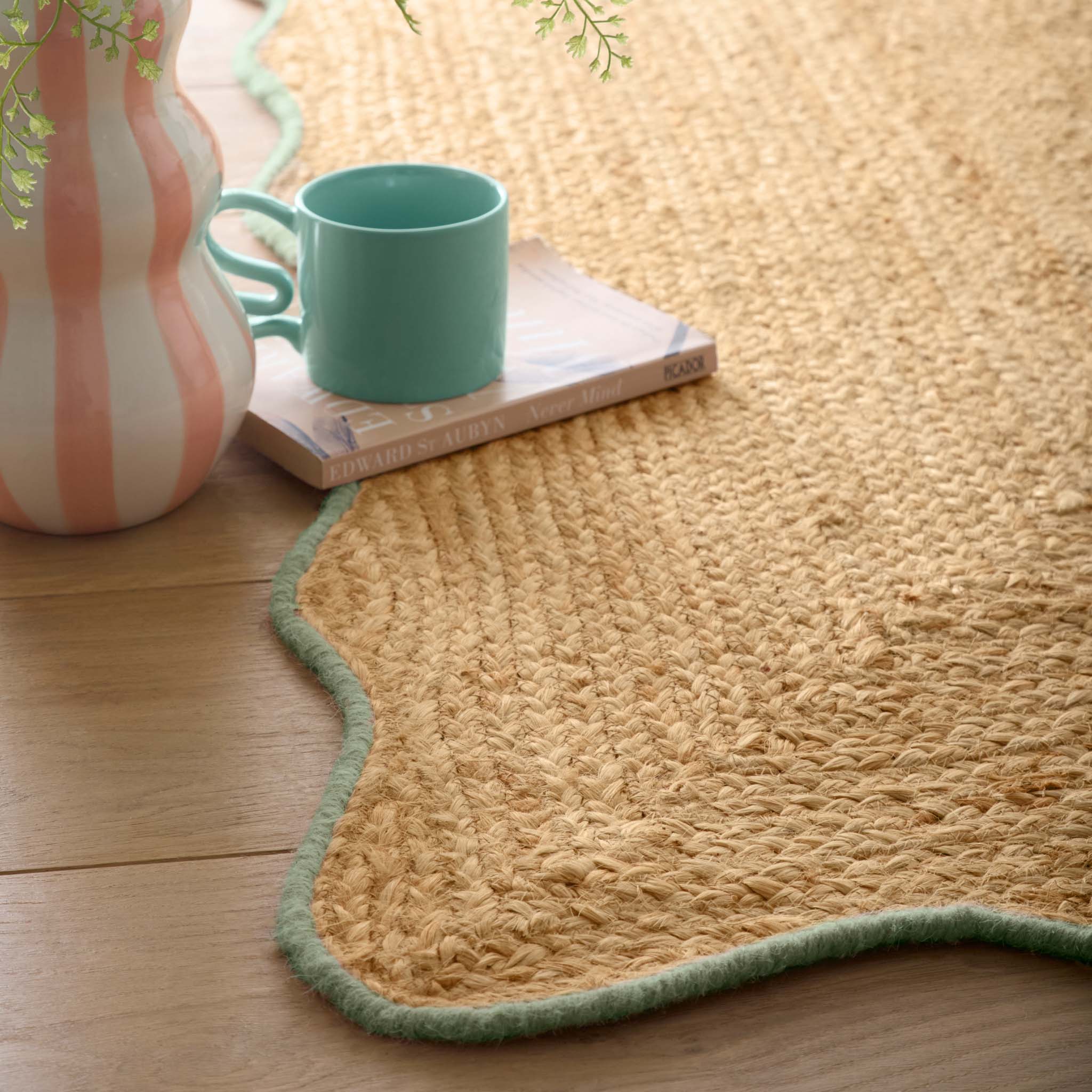 Jute Scalloped Edge Green Runner - a 100% jute runner featuring a green scalloped border.