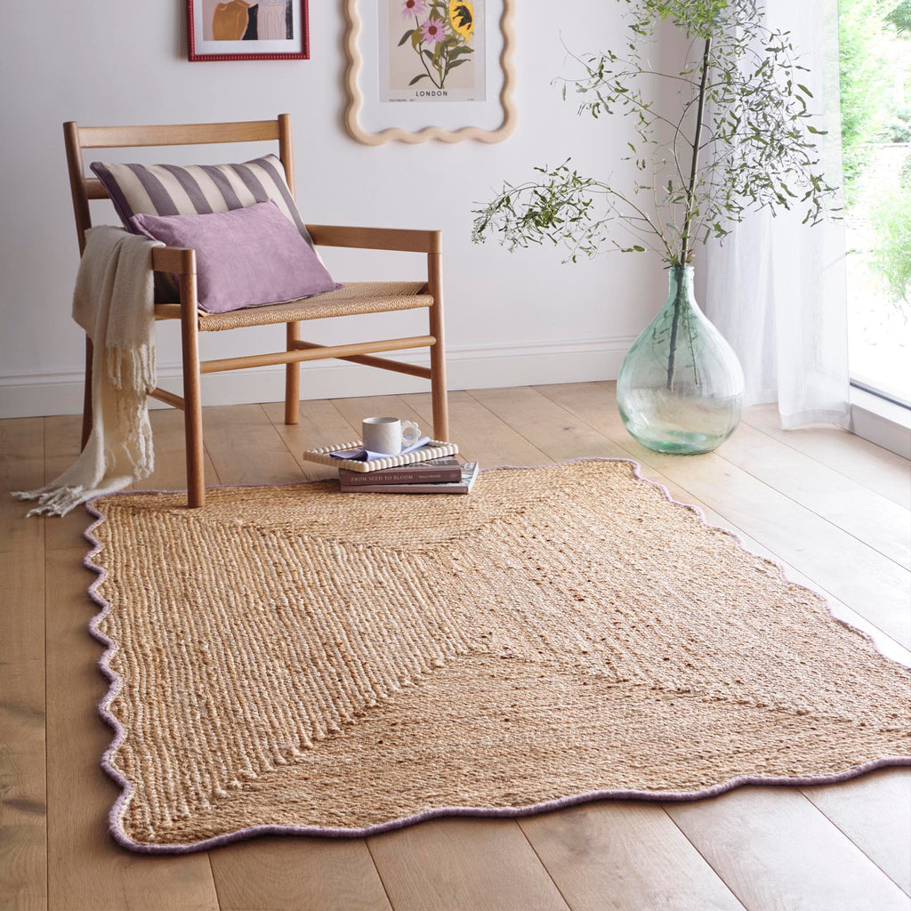 Jute Scalloped Edge Rug Lilac- Jute scalloped edge rug with pink wool whipped border.