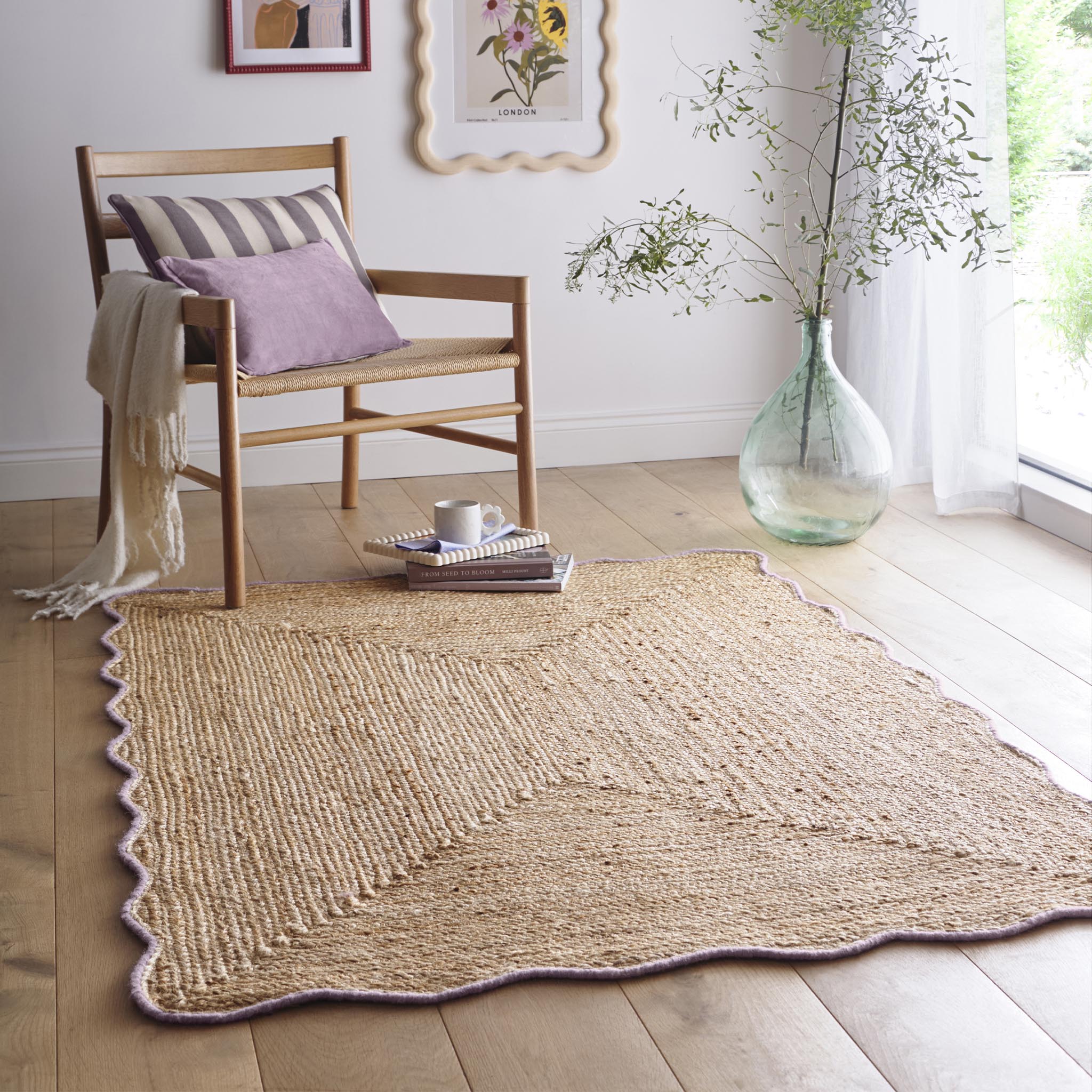 Jute Scalloped Edge Rug Lilac- Jute scalloped edge rug with pink wool whipped border.