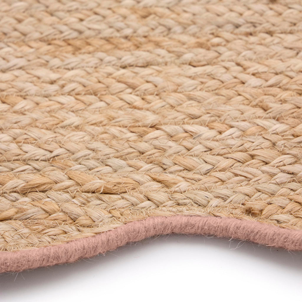 Jute Scalloped Edge Peach Rug- Jute rug wth a pink wool wiped scalloped edge.
