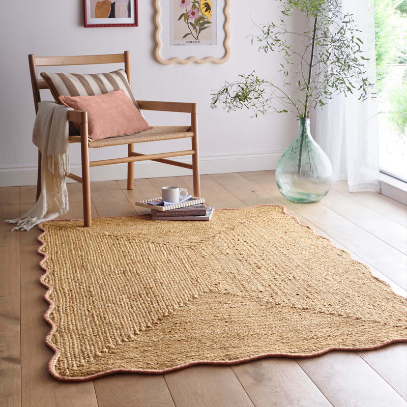 Jute Scalloped Edge Peach Rug - a 100% jute rug featuring a pink scalloped border.
