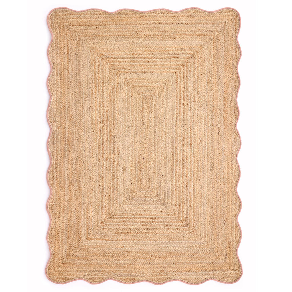 Jute Scalloped Edge Peach Rug- Jute rug wth a pink wool wiped scalloped edge.
