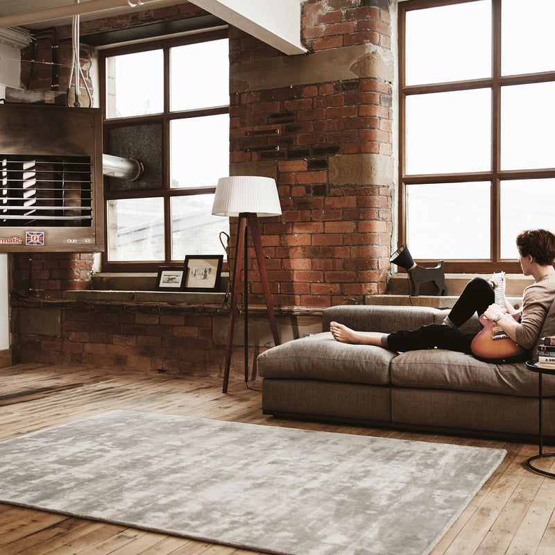 Karma Cloud Grey Rug made from 100% viscose, featuring different shades of light and dark cream.