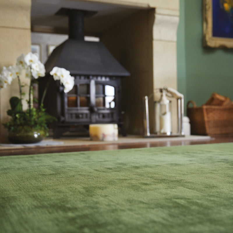 Karma Fern Rug made from 100% viscose, featuring different shades of light and dark green.
