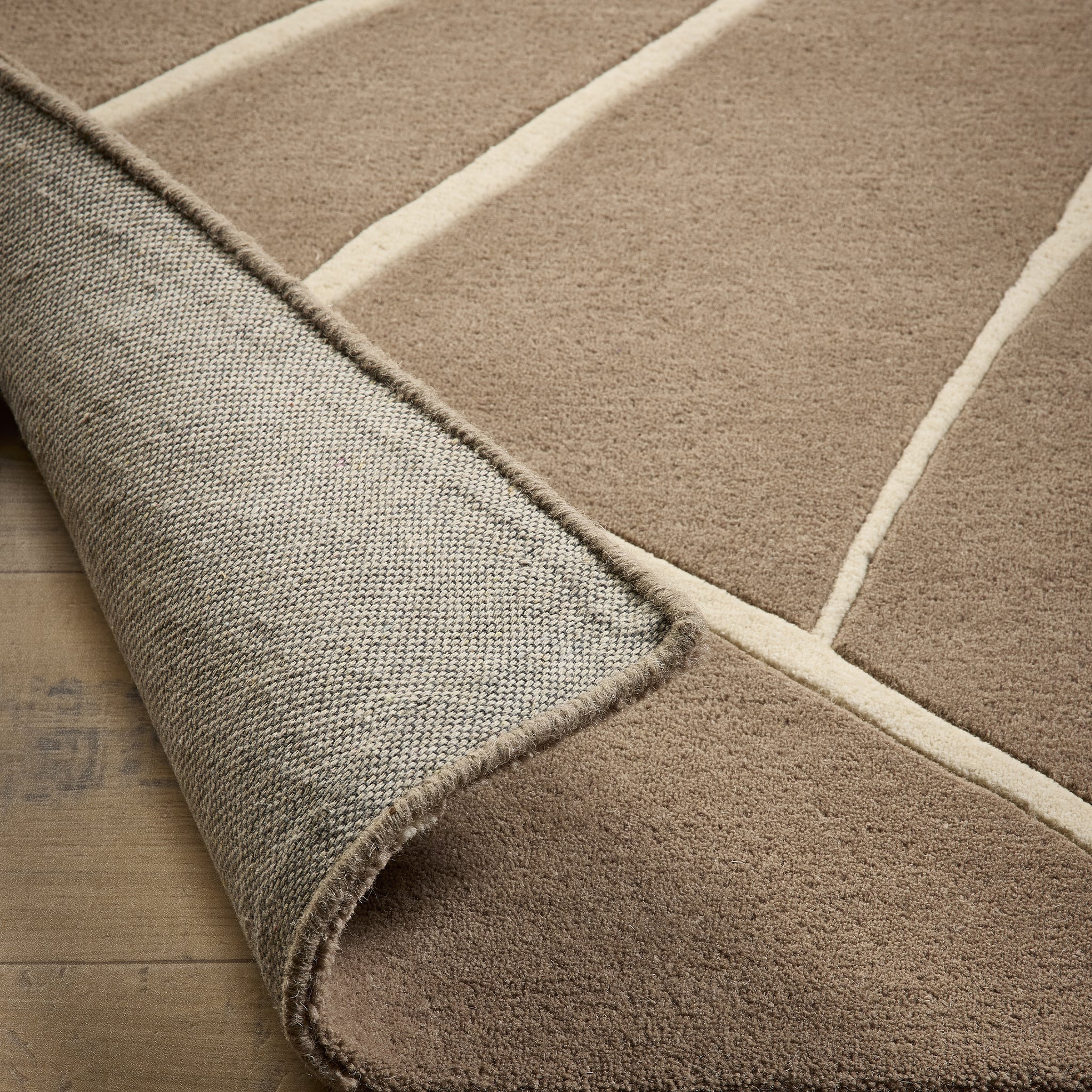 Kintsugi Rug- 100% wool cut pile, hand-tufted and carved rug in Stone with a carved design. 