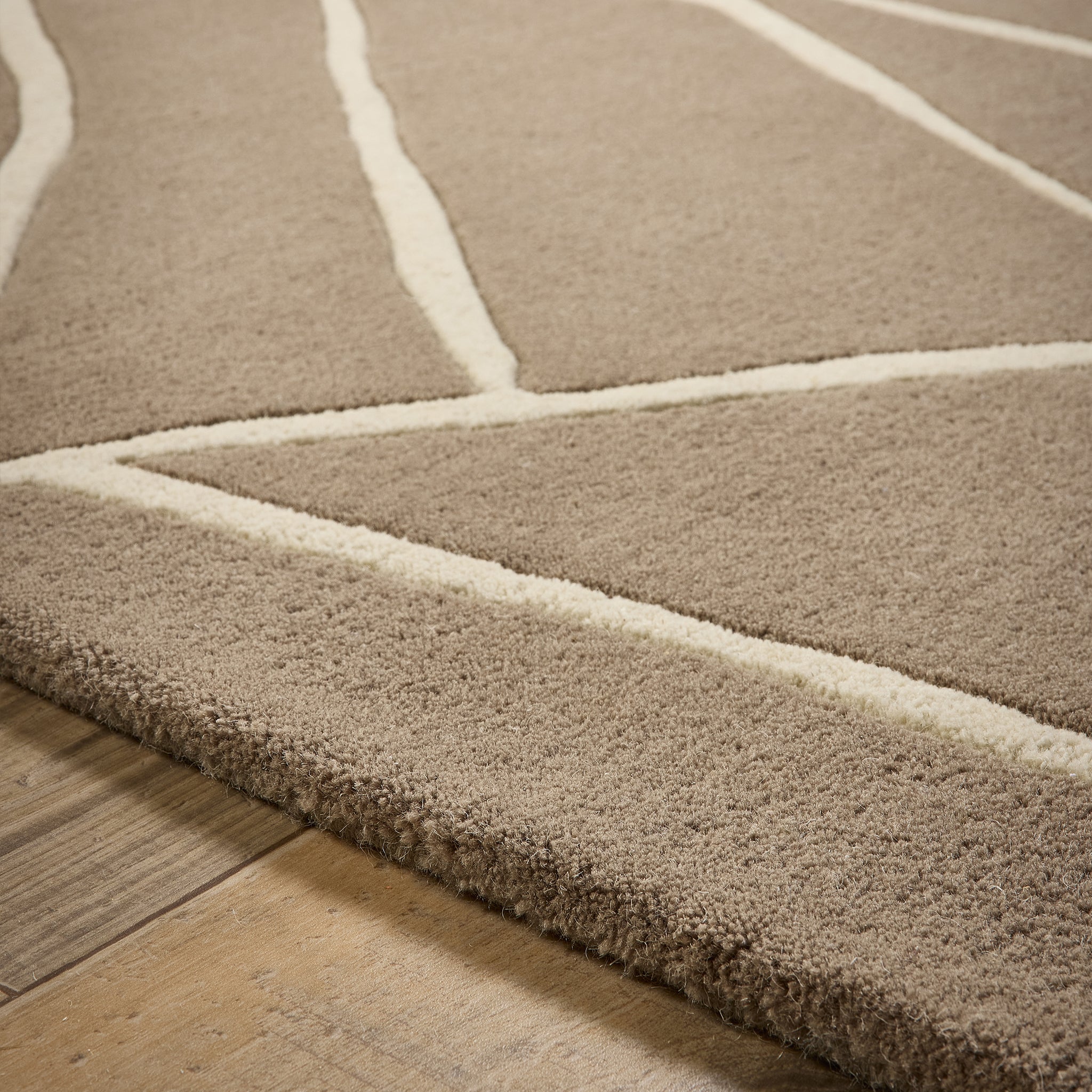 Kintsugi Rug- 100% wool cut pile, hand-tufted and carved rug in Stone with a carved design. 