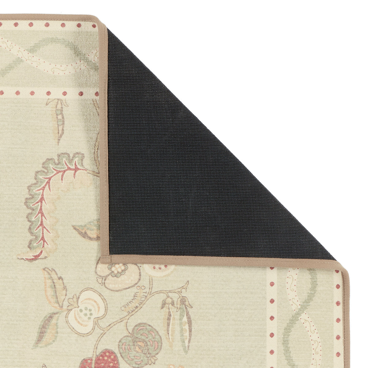 Close-up of Kitchen Garden Olive & Russet Eco-Washable showing a floral design with the rubber backing. 