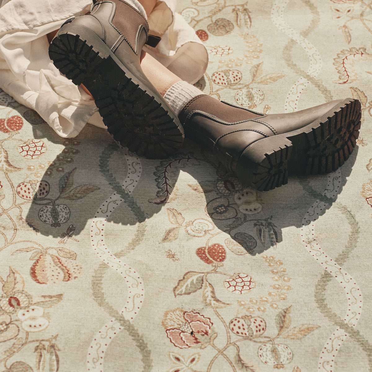 Close-up of Kitchen Garden Olive & Russet Eco-Washable with a floral inspred pattern. 