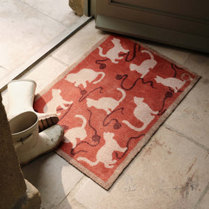 Kitty Cat Rust Doormat- 100% recycled cotton doormat featuring cats playing with yarn.